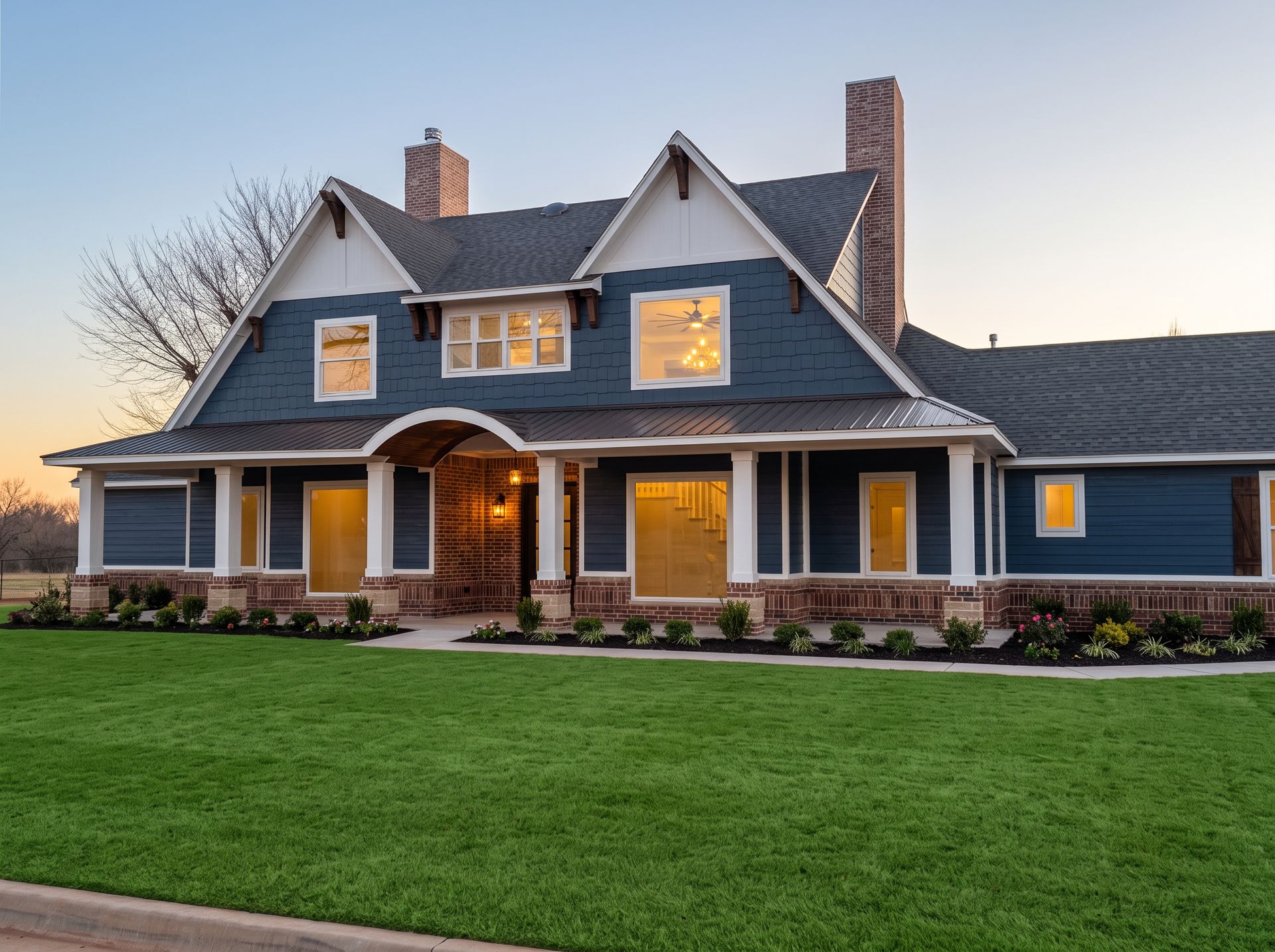 painting contractor in Moore OK — custom home exterior painted navy with white trim