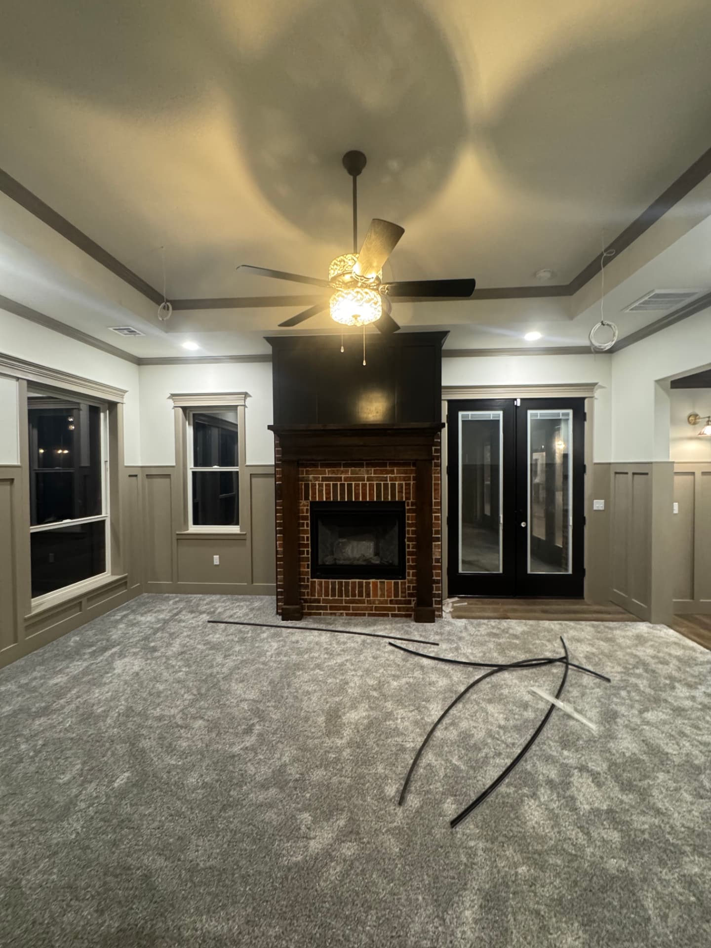 interior painting of living room wainscoting crown molding and fireplace in Moore OK